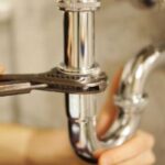 Jlau Associates Plumber working